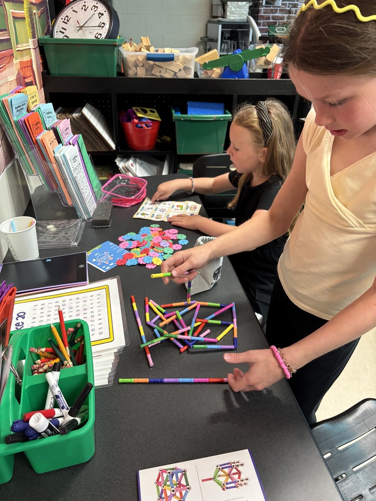 students building with math STEM bins