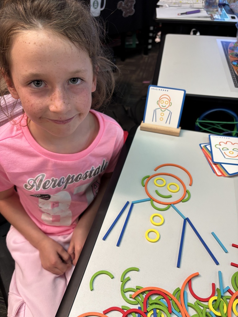 students building with math STEM bins