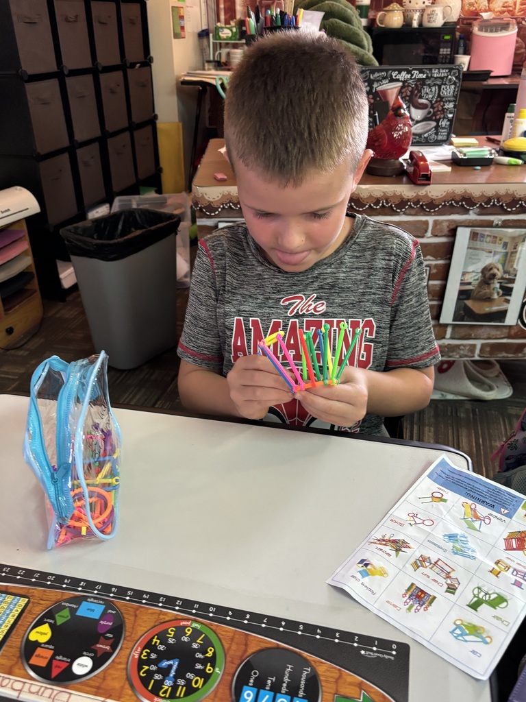 students building with math STEM bins