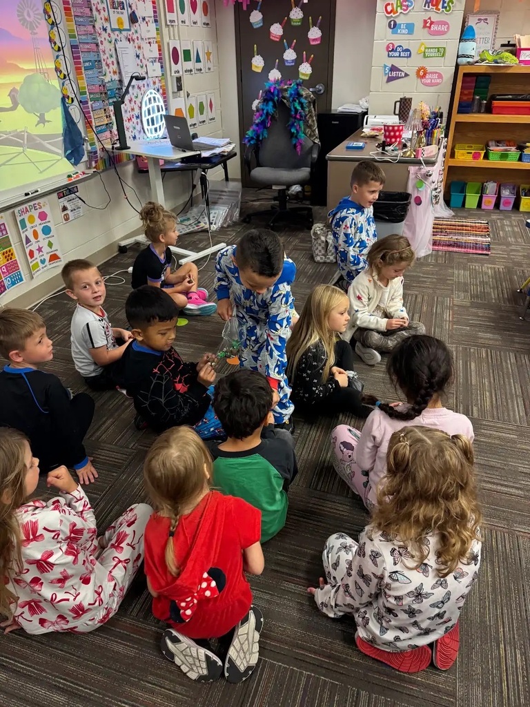 student holding his bunny walking through a group of kids