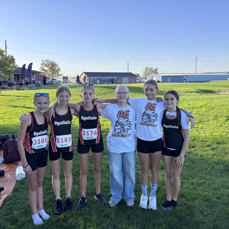 cross country runners standing posing for a picture