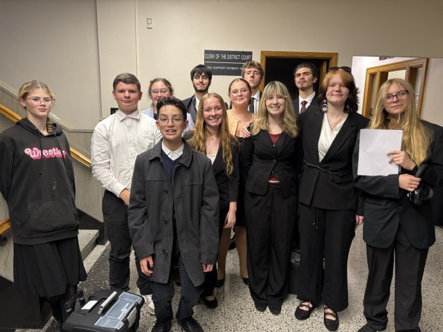 mock trial team standing together for a team photo