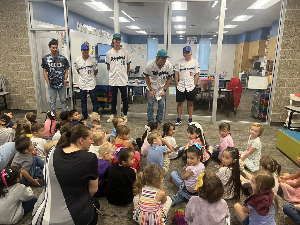 Raptors players with students