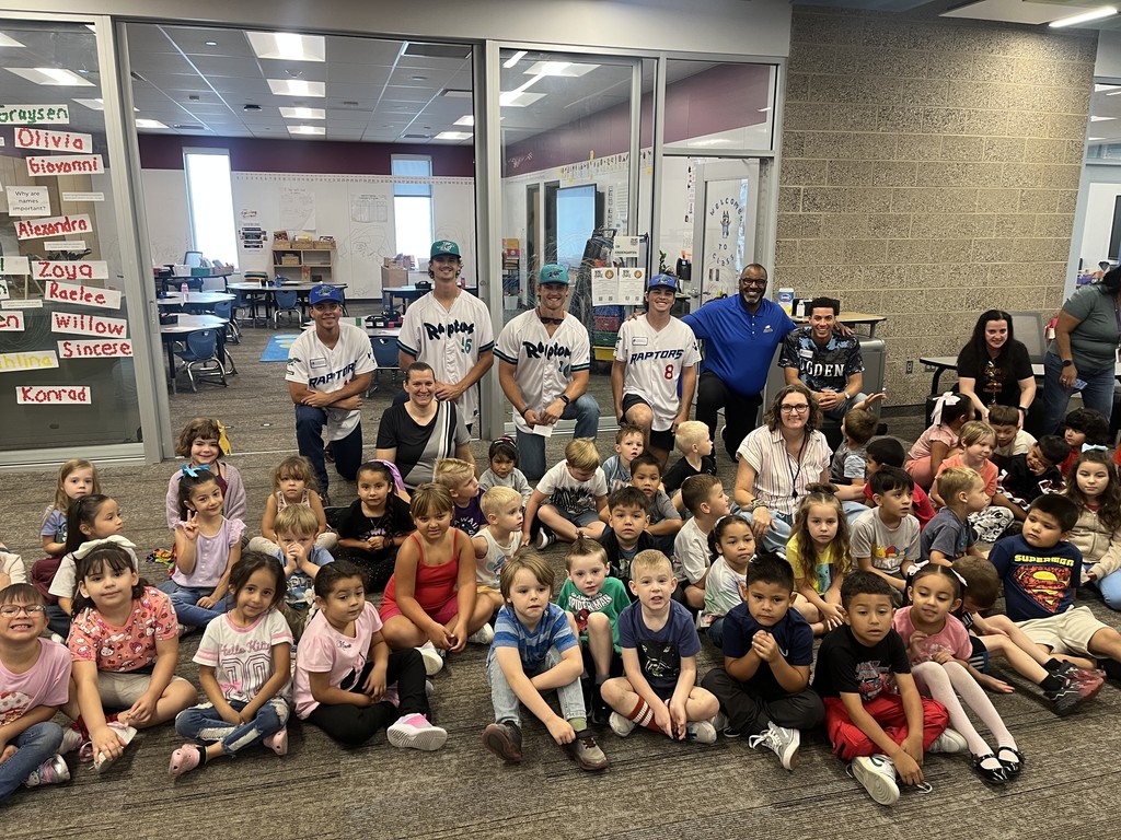 Raptors players with students