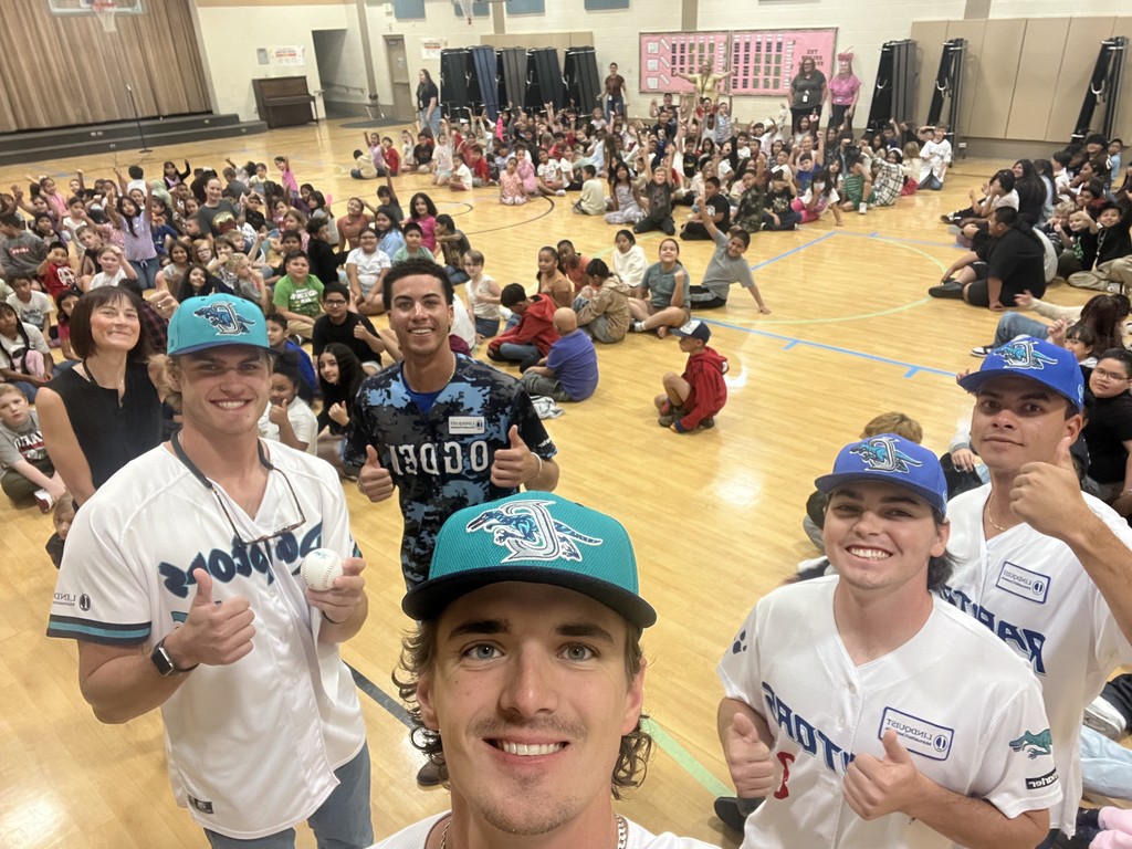 Raptors players with students