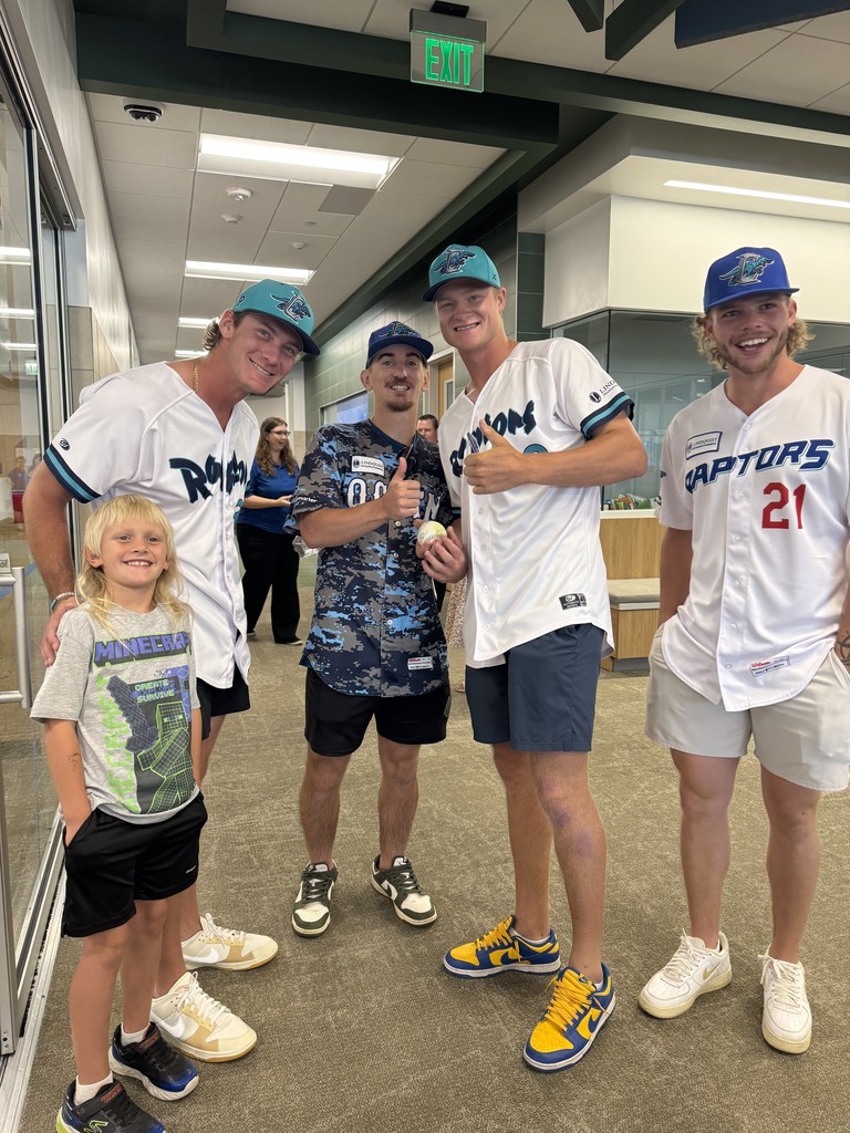 Student with Raptors players