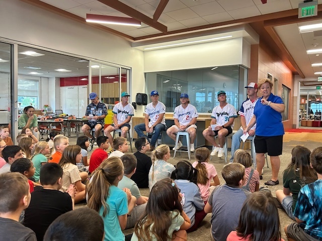 Students with Ogden Raptors Baseball players