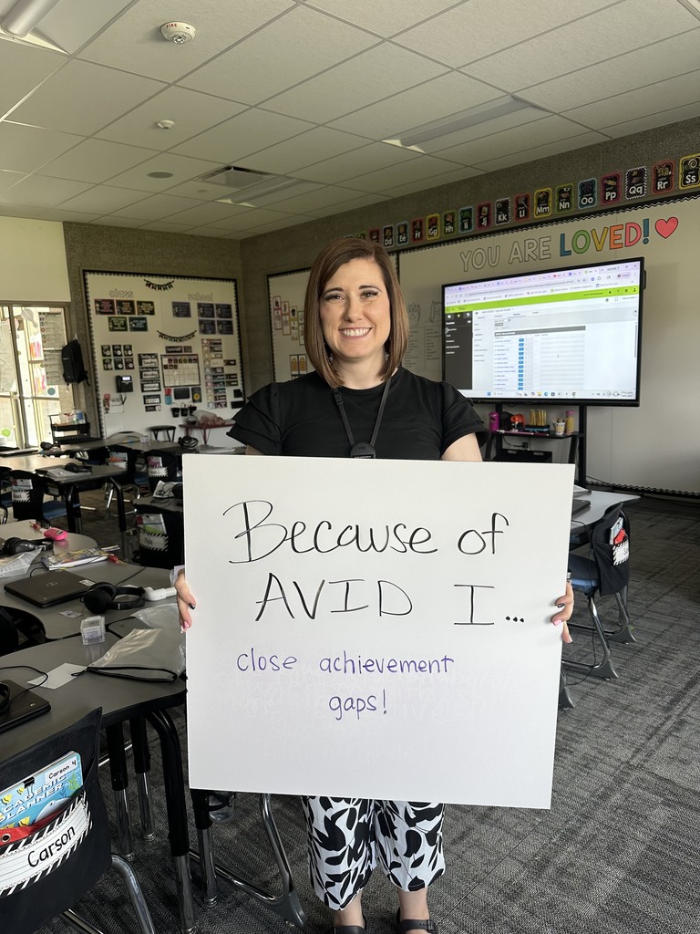 Teacher with AVID Sign