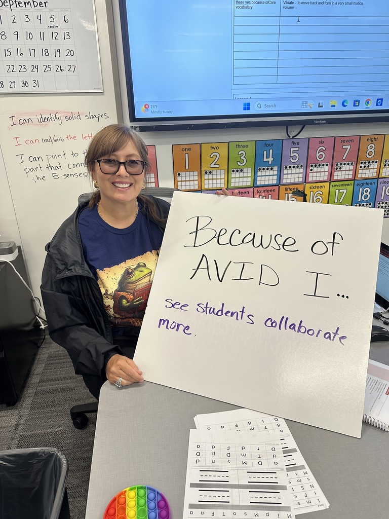 Teacher with AVID sign