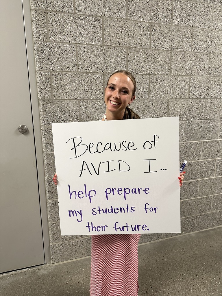 Teacher with AVID Sign