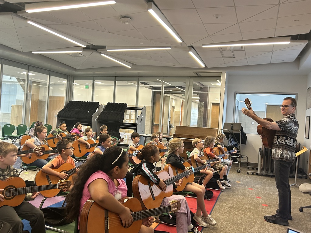 Kids with guitars in music class
