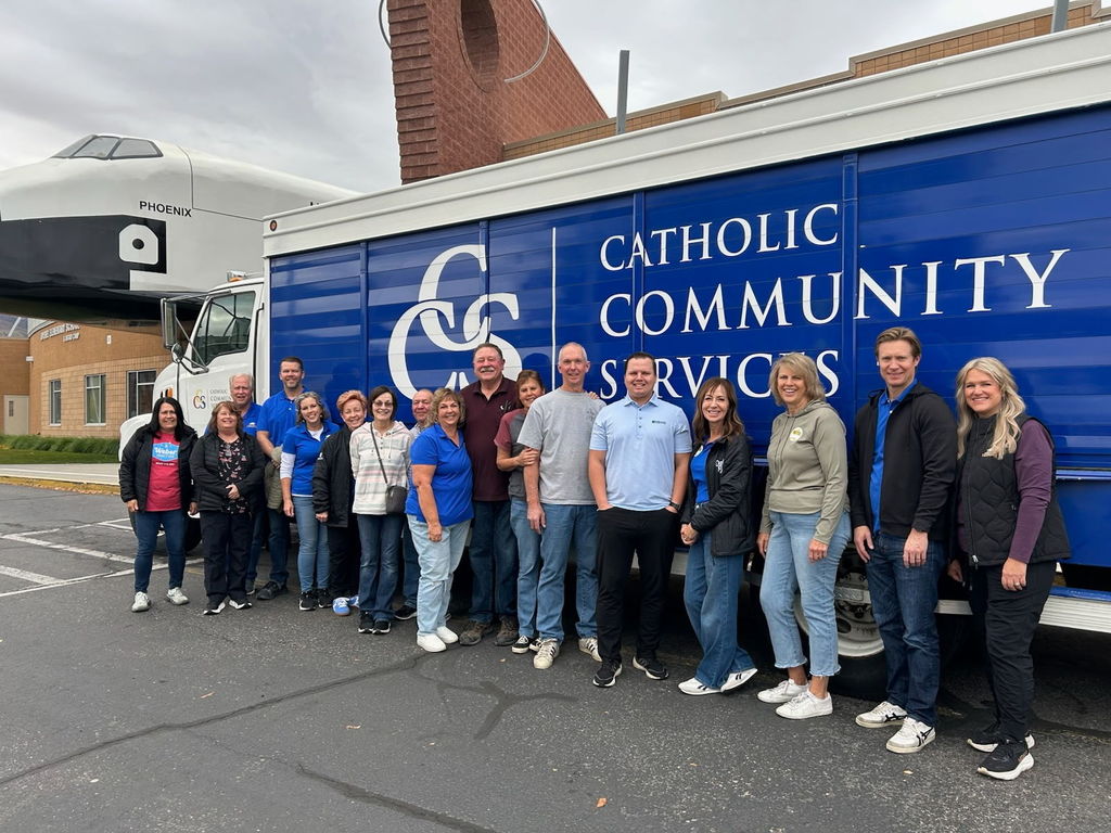 OSF Board members standing in front of CCS truck