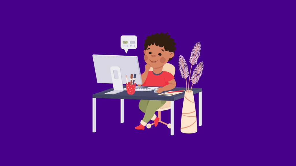 Boy sitting at desk with a computer.