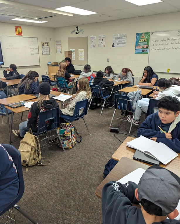 students at desks in classroom