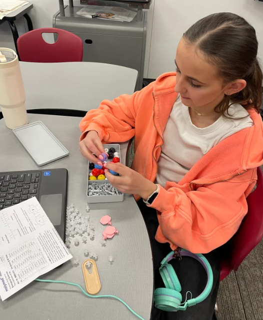 students working with new science supplies