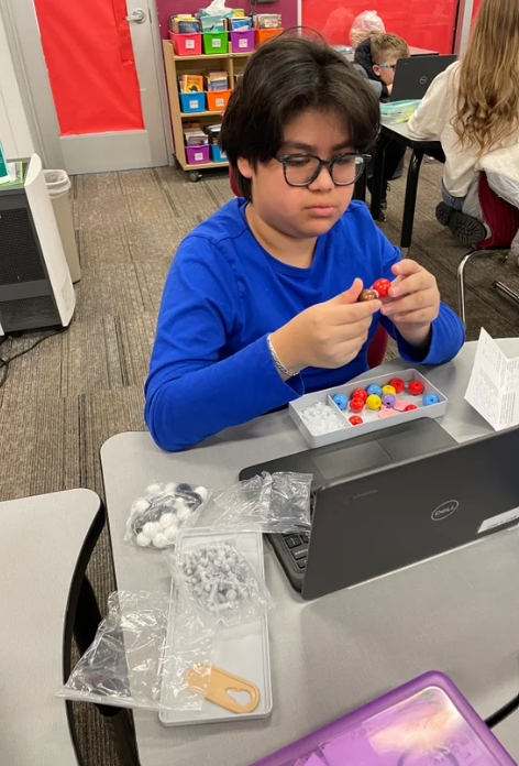 students working with new science supplies