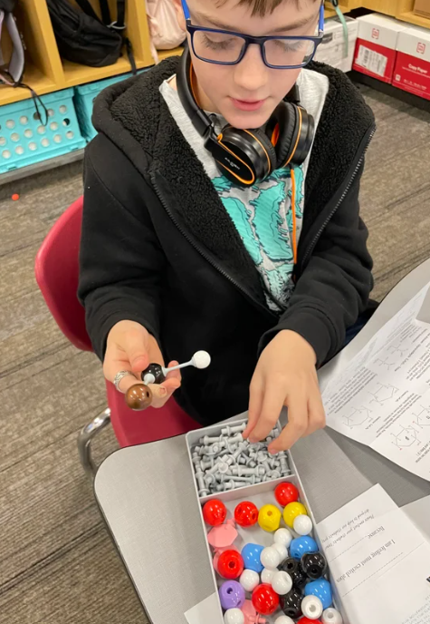 students working with new science supplies