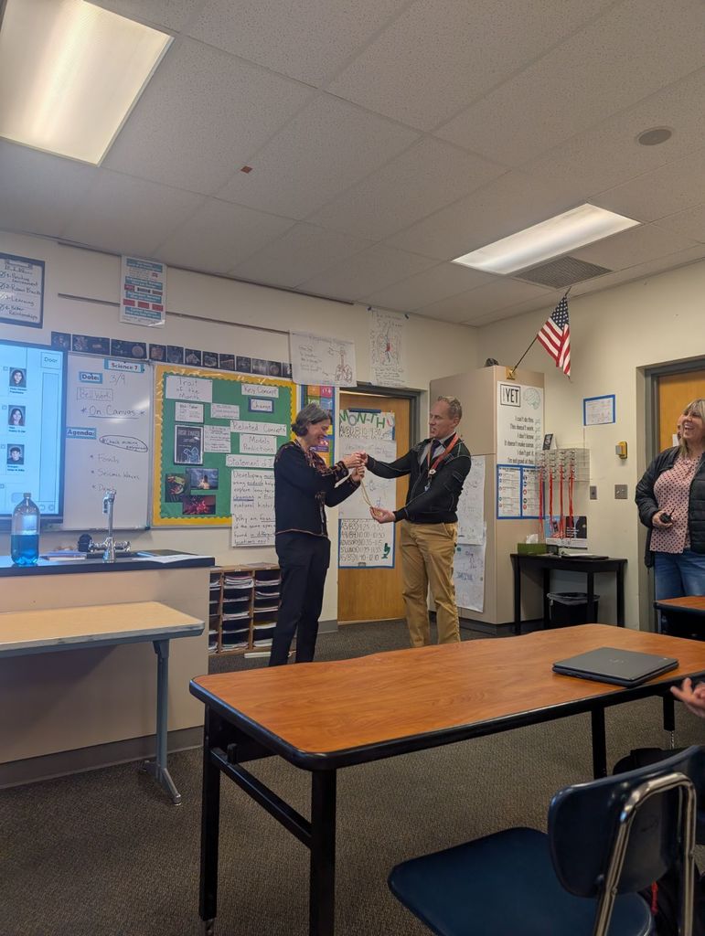 Mrs. Moore receiving the award