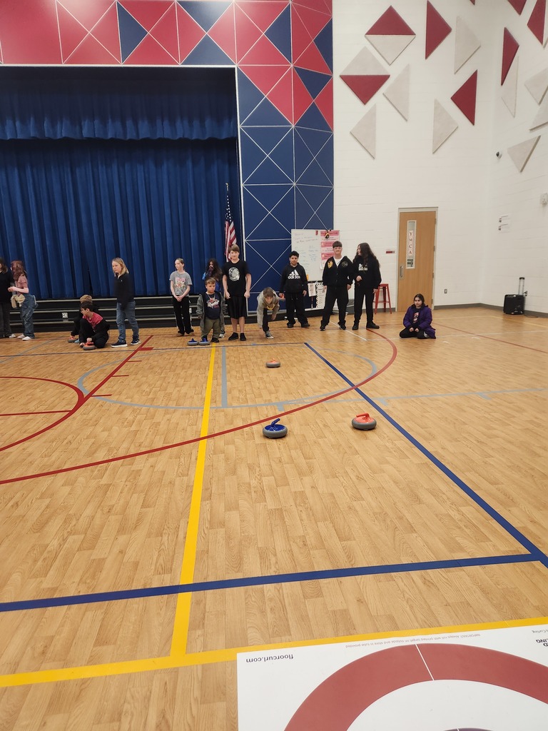 students trying curling