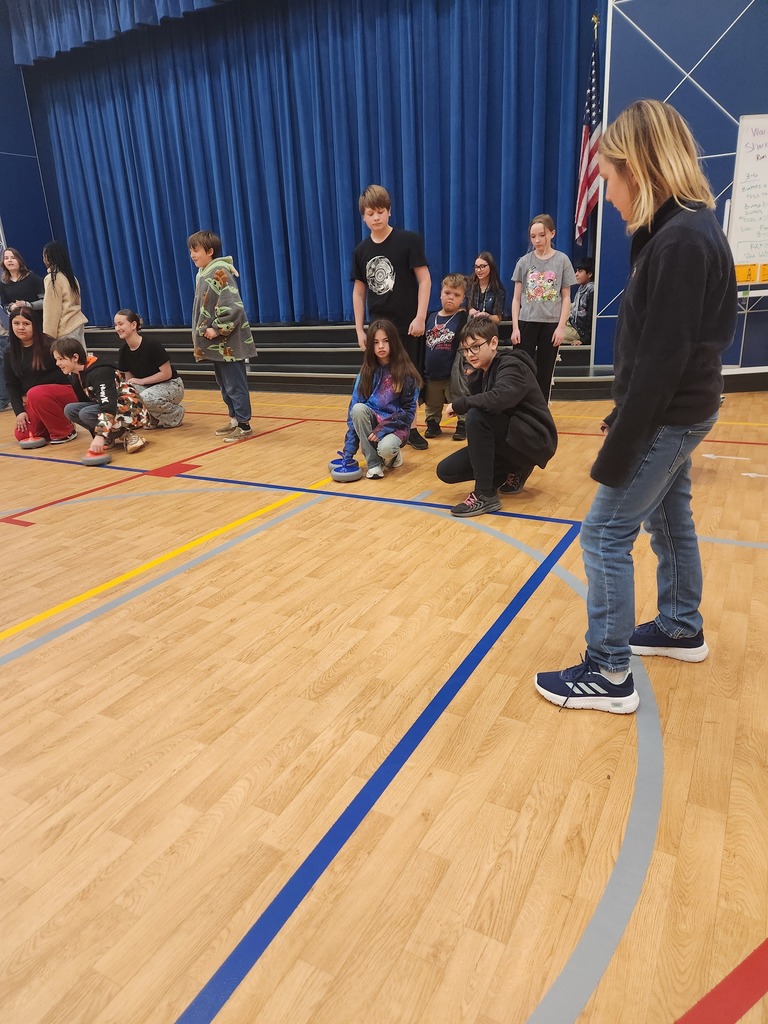 students trying curling
