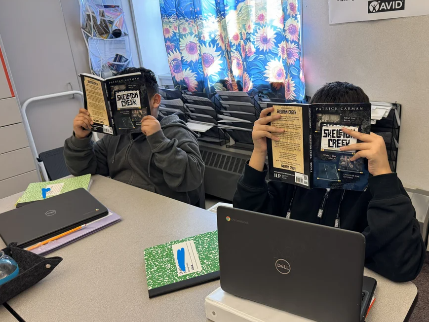 students reading at their desks