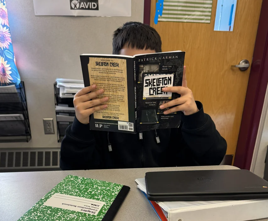 student reading book