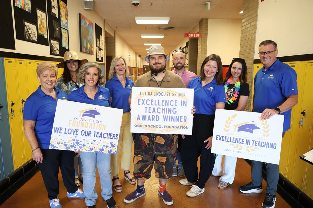 Teacher winner with foundation board members