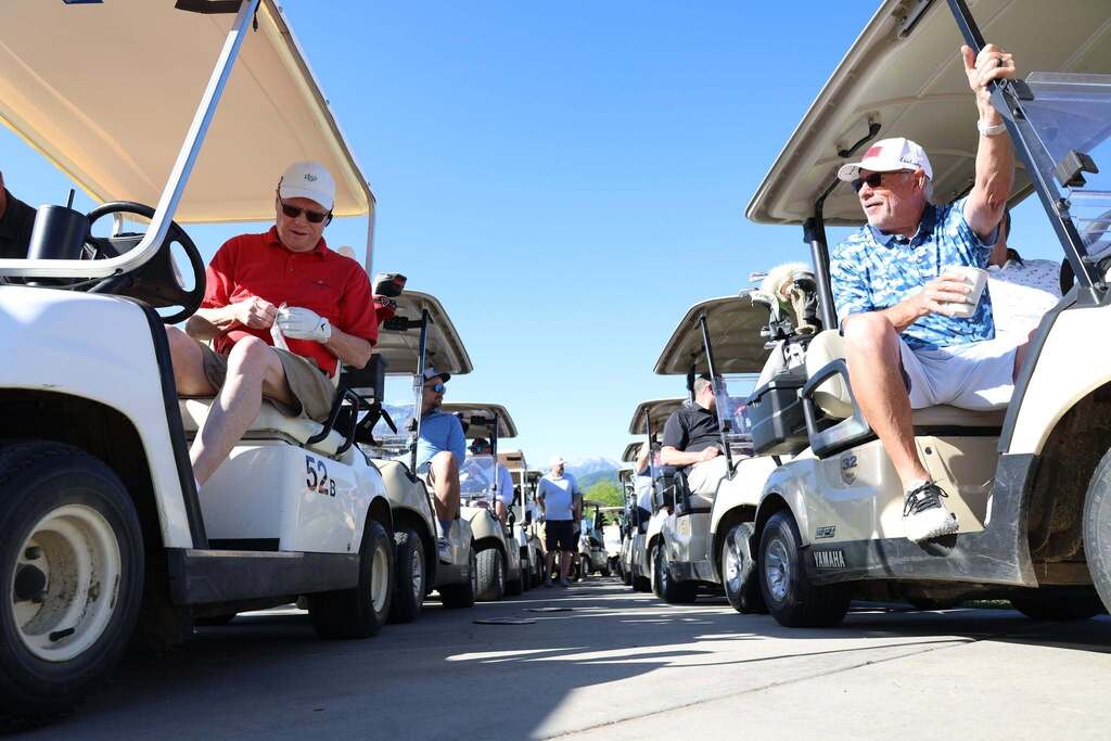 golfers on carts