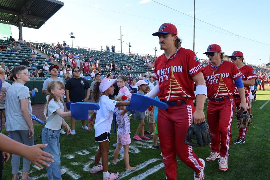 Raptors players with students