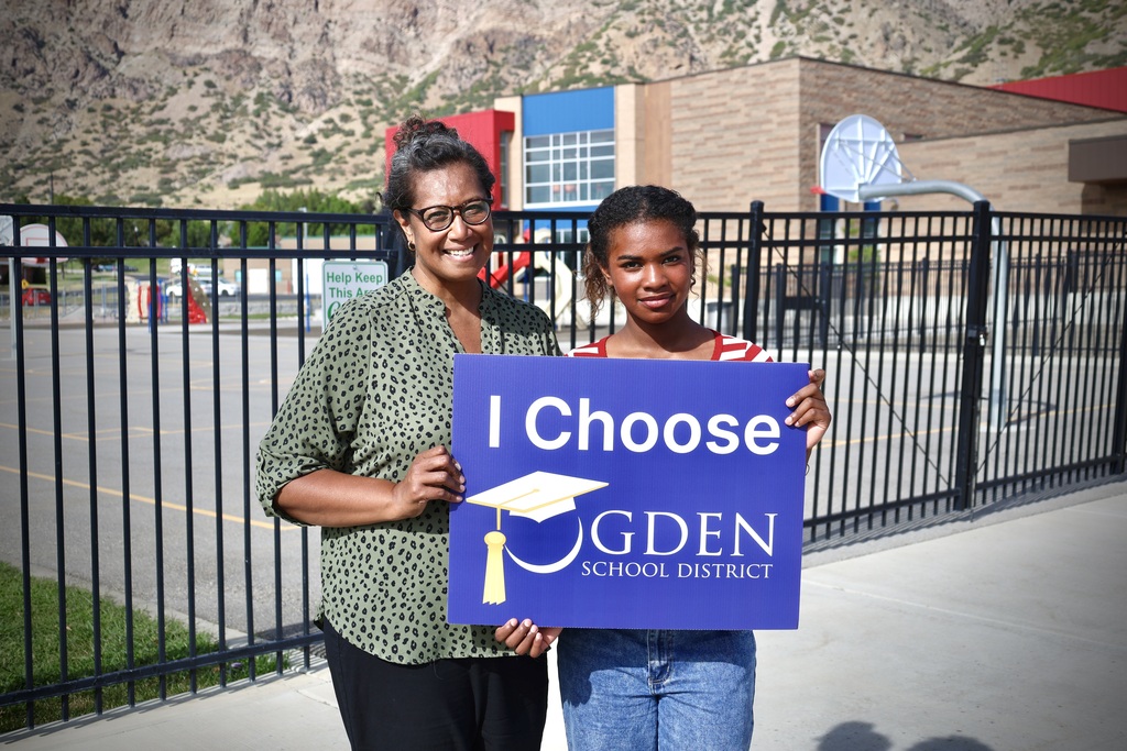 mother and daughter outside of a school