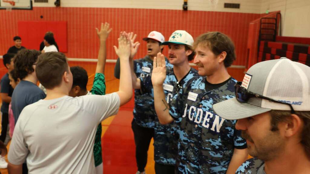Raptors players with students