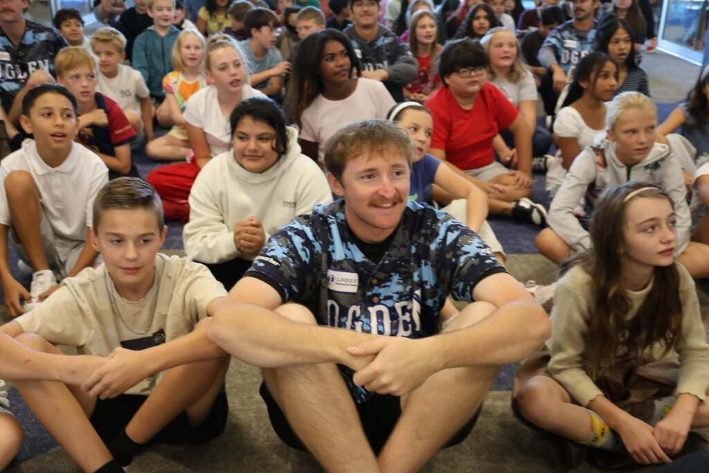 raptors players with students