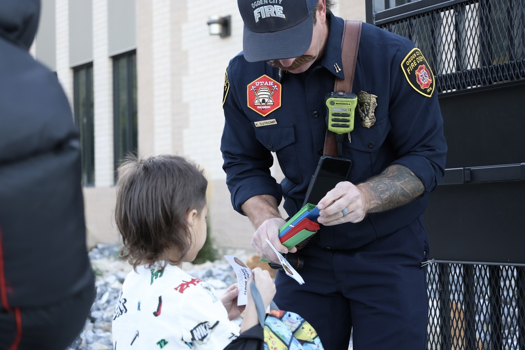 firefighter talking with student