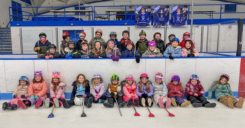 A group of student posing in their hockey grear 