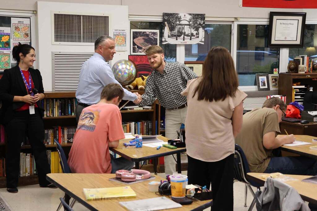 Dr. Powell presenting Mr. NeSmith Patriot of the Month