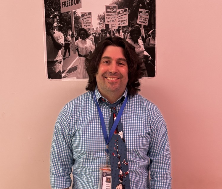 man posing and smiling