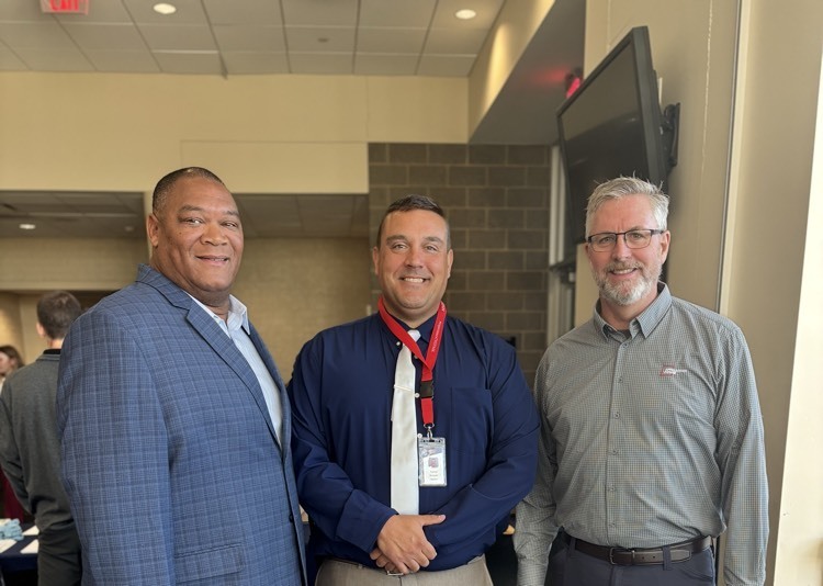 three men smiling