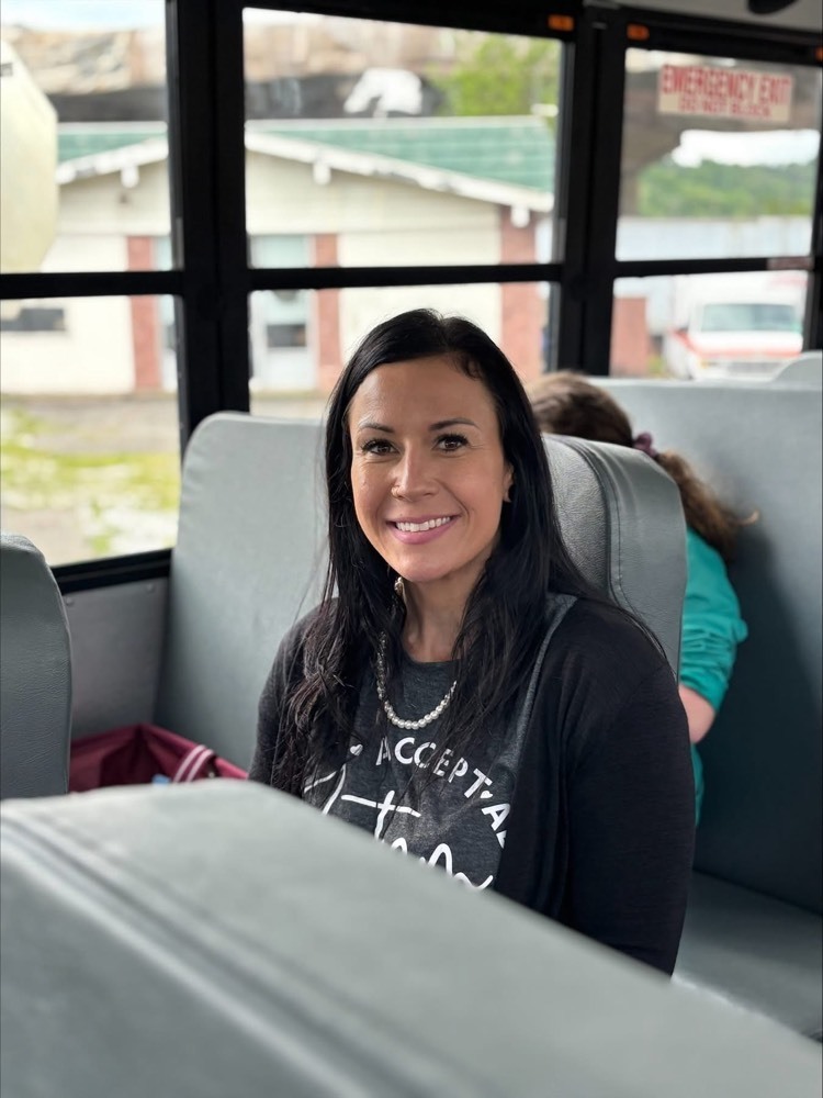 Teacher posing on bus 