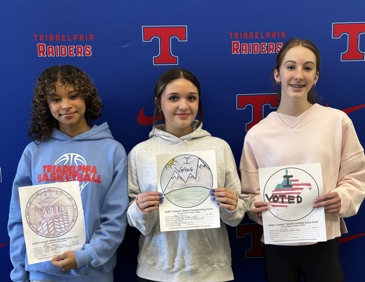 students posing with stickers 