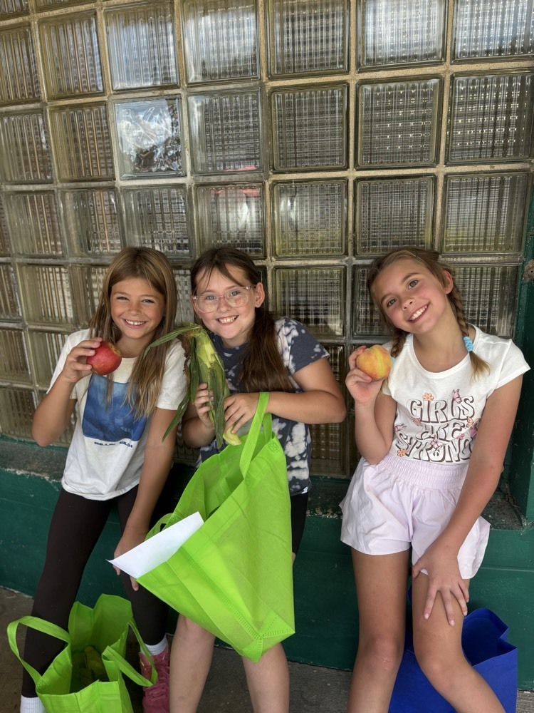 smiling holding apples