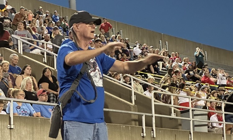 man conducting music