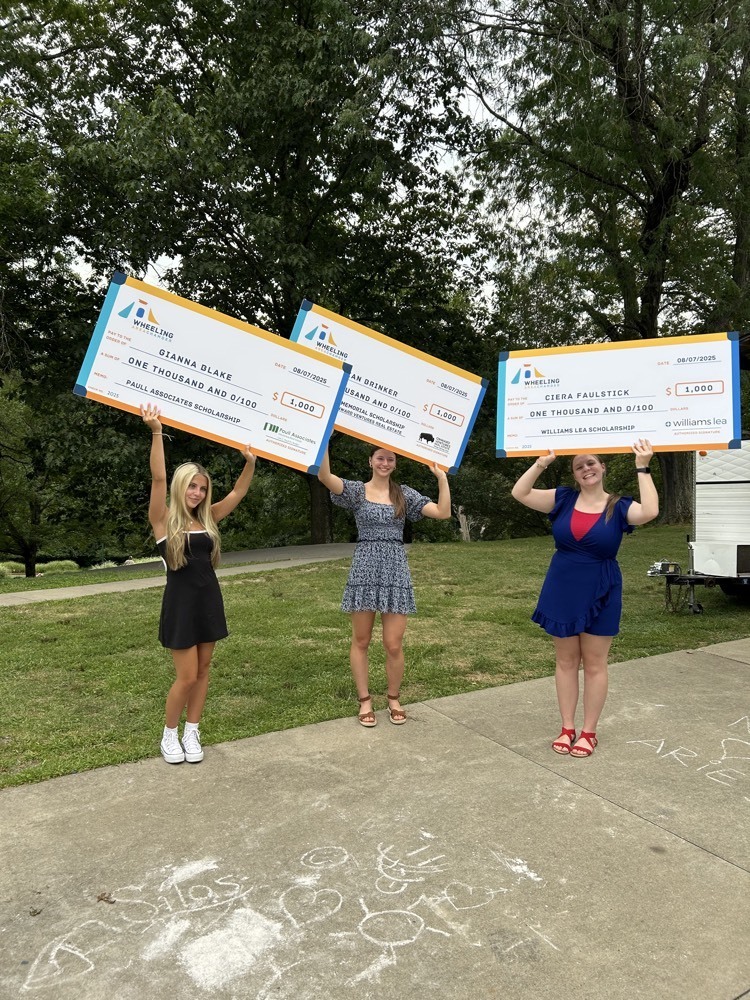 students posing with a check 