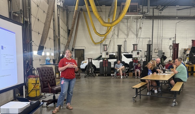 Nurse instructing bus drivers