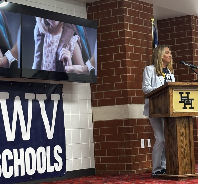 woman speaking at podium