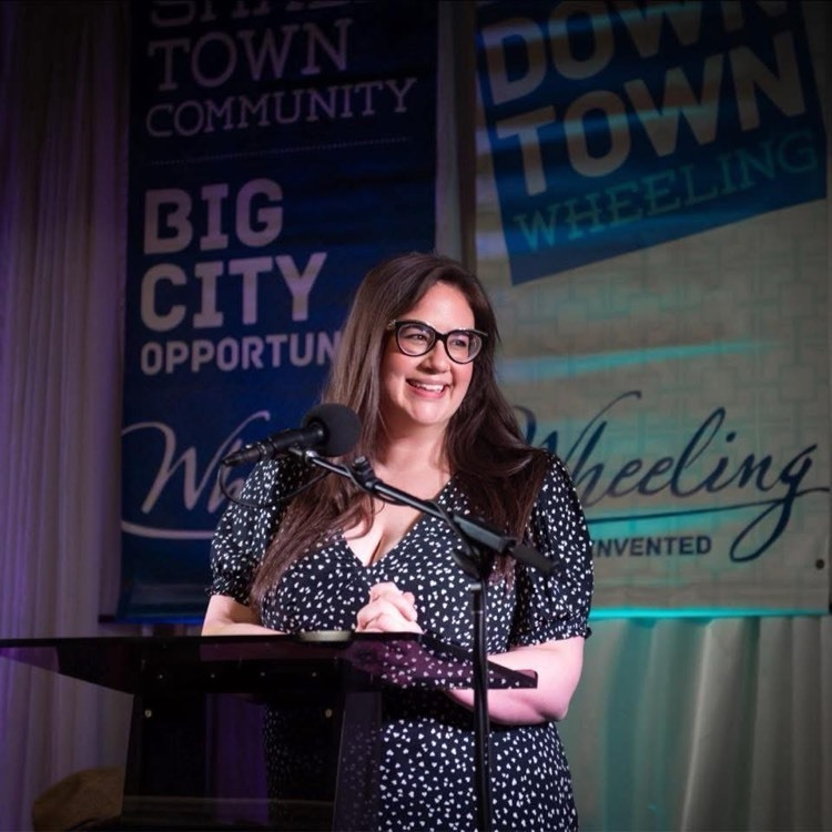 woman presenting at podium
