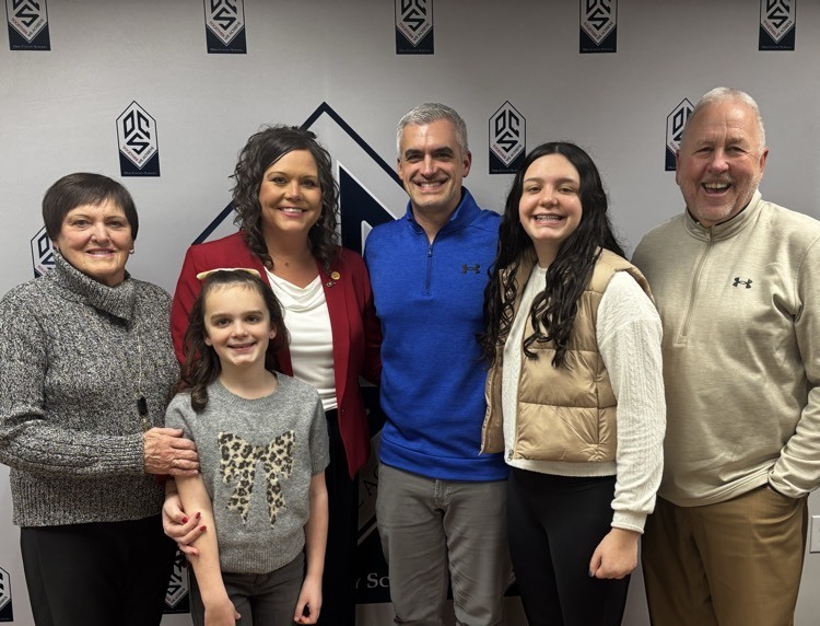 a family posing and smiling