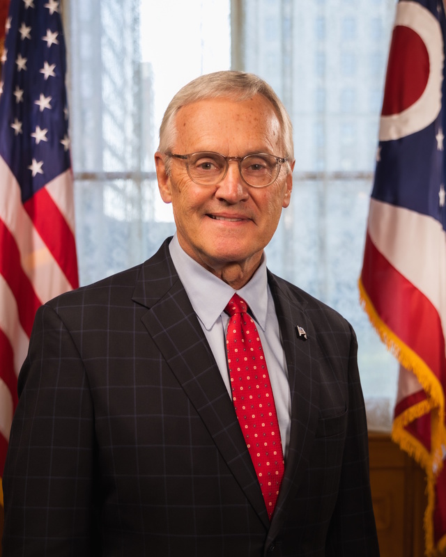 Jim Tressel with the American Flag and Ohio Flag