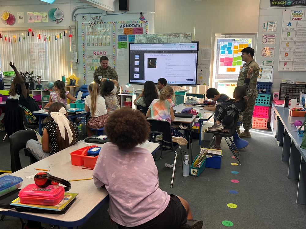 Members of the 96th Communications Squadron presenting a Cyber Awareness Course