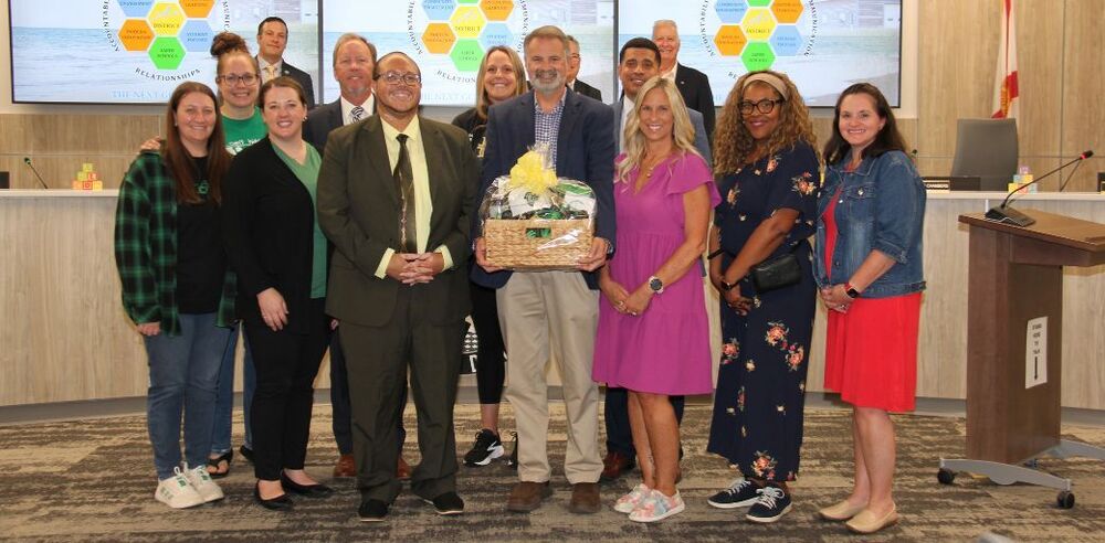 Craig Kinsley, Assistant Principal II of Lewis School, at the SB Meeting with school administrators, family, and friends.