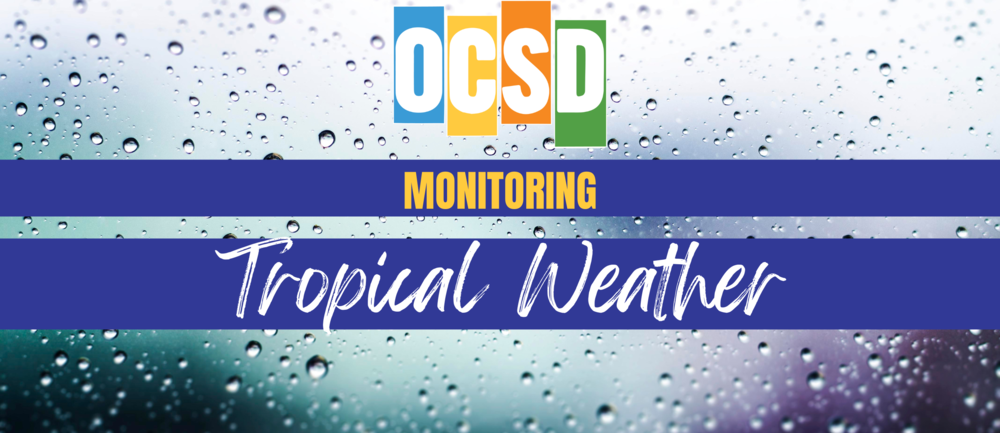 Graphic featuring the colorful OCSD logo over a background of raindrops on glass. Two dark blue banners across the center read “MONITORING” in yellow capital letters and “Tropical Weather” in large white script.